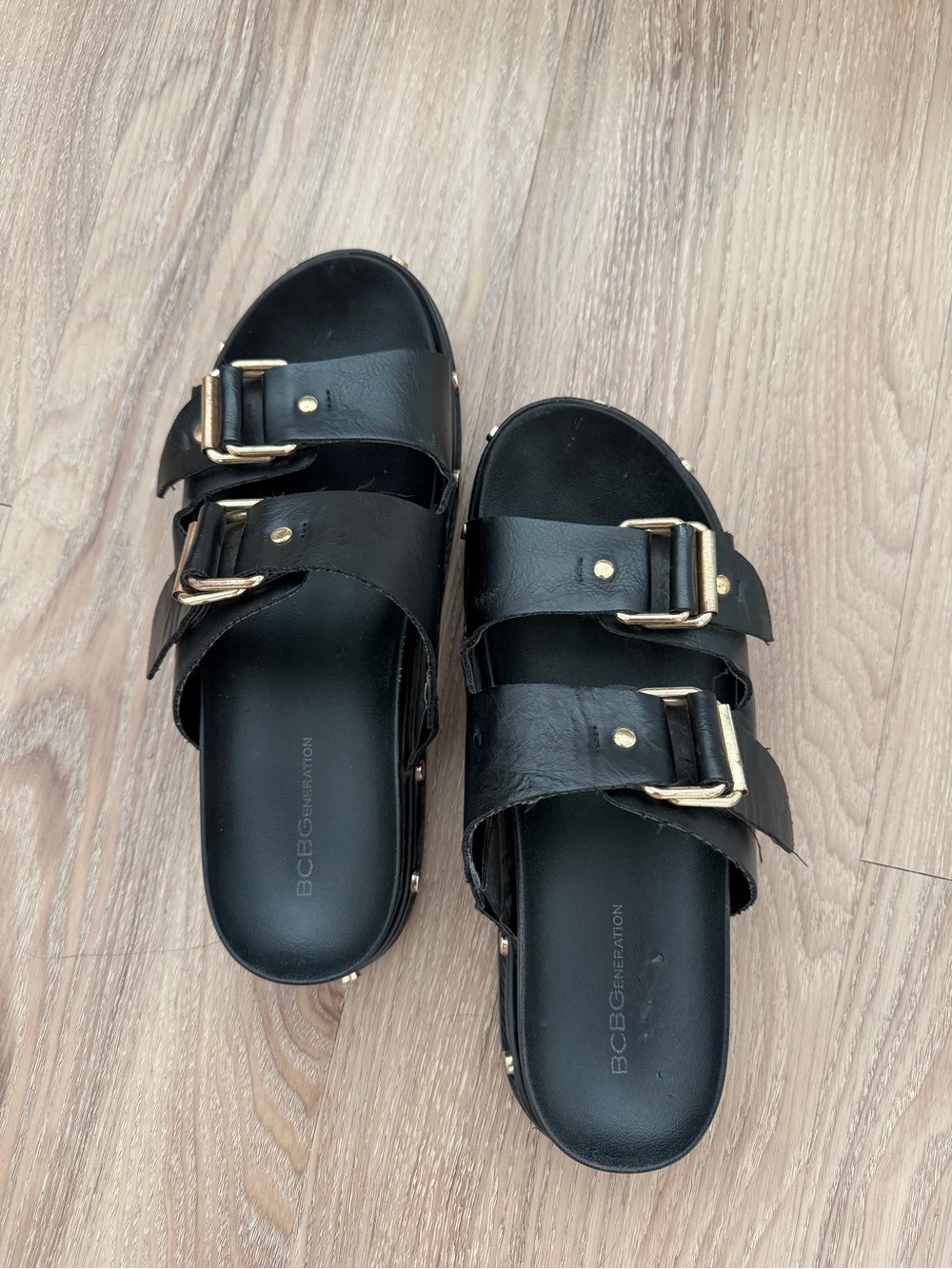 BCBGeneration Black Slide Sandals with Gold Buckles